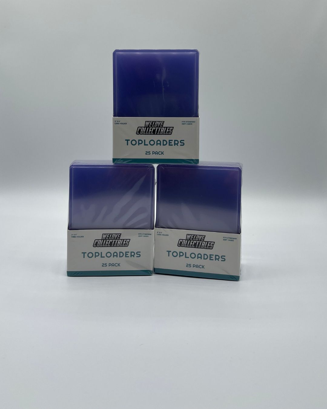 Three 25 packs of We Love Collectibles branded Toploaders arranged in a pyramid.