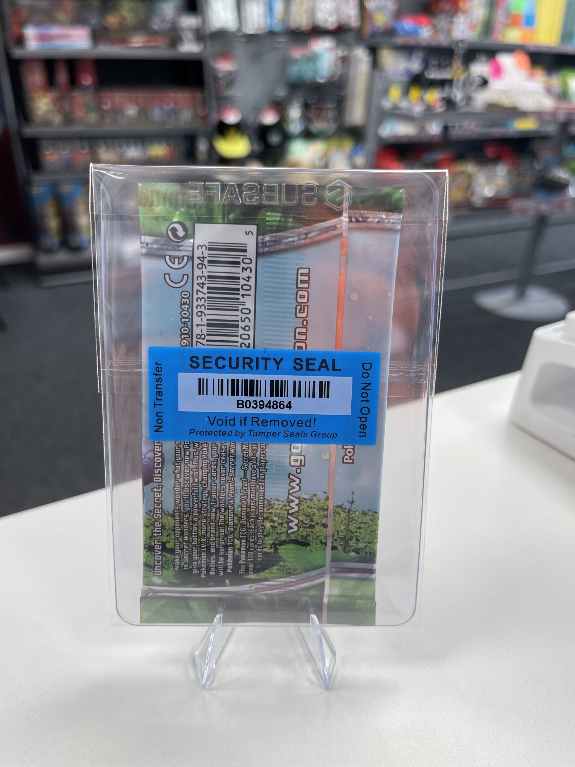 The WLC security seal on the back of a vintage Pokémon booster pack, confirming its authenticity.