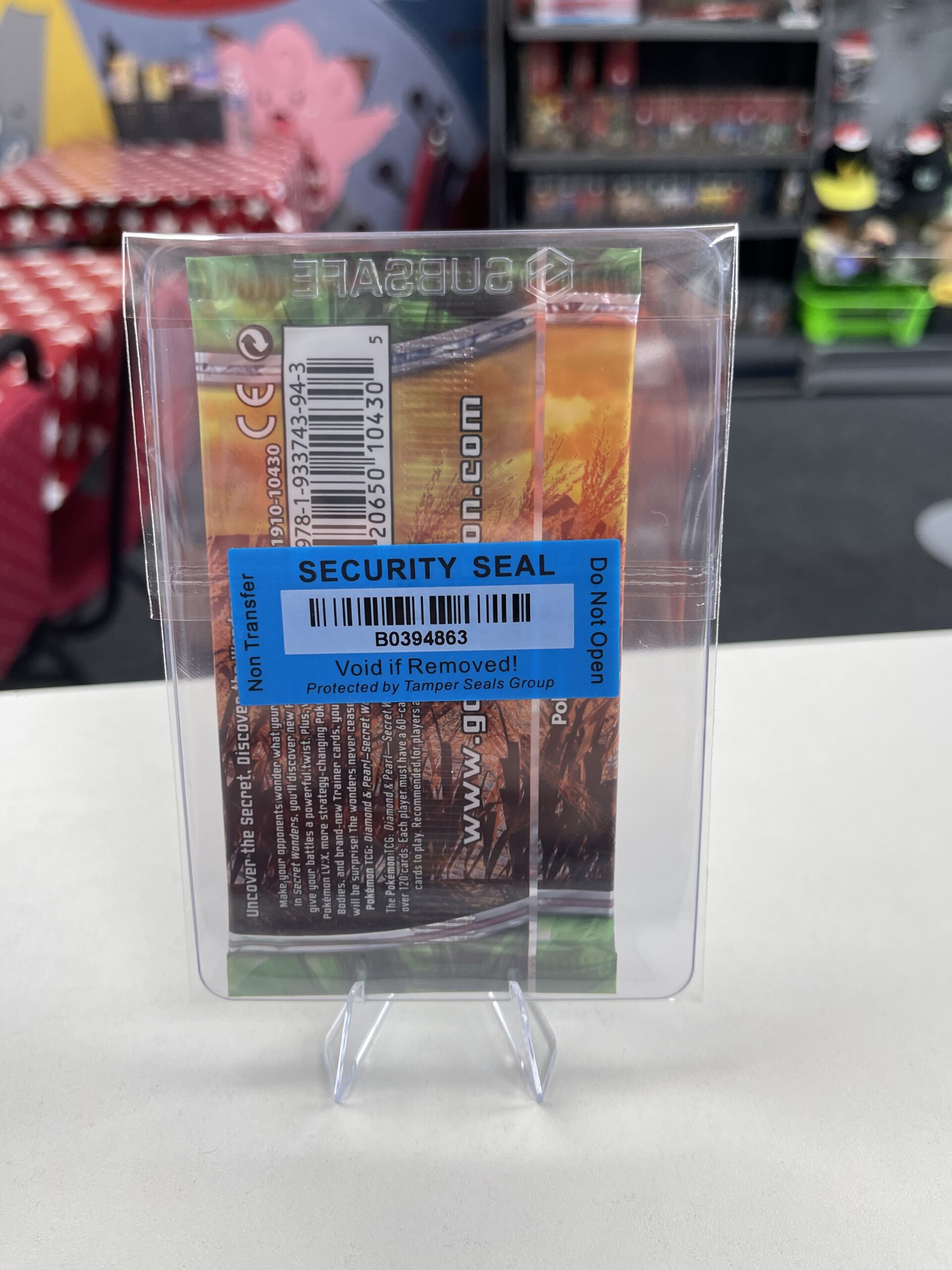 The WLC security seal on the reverse of the Gallade Secret Wonders booster pack, confirming its authenticity.