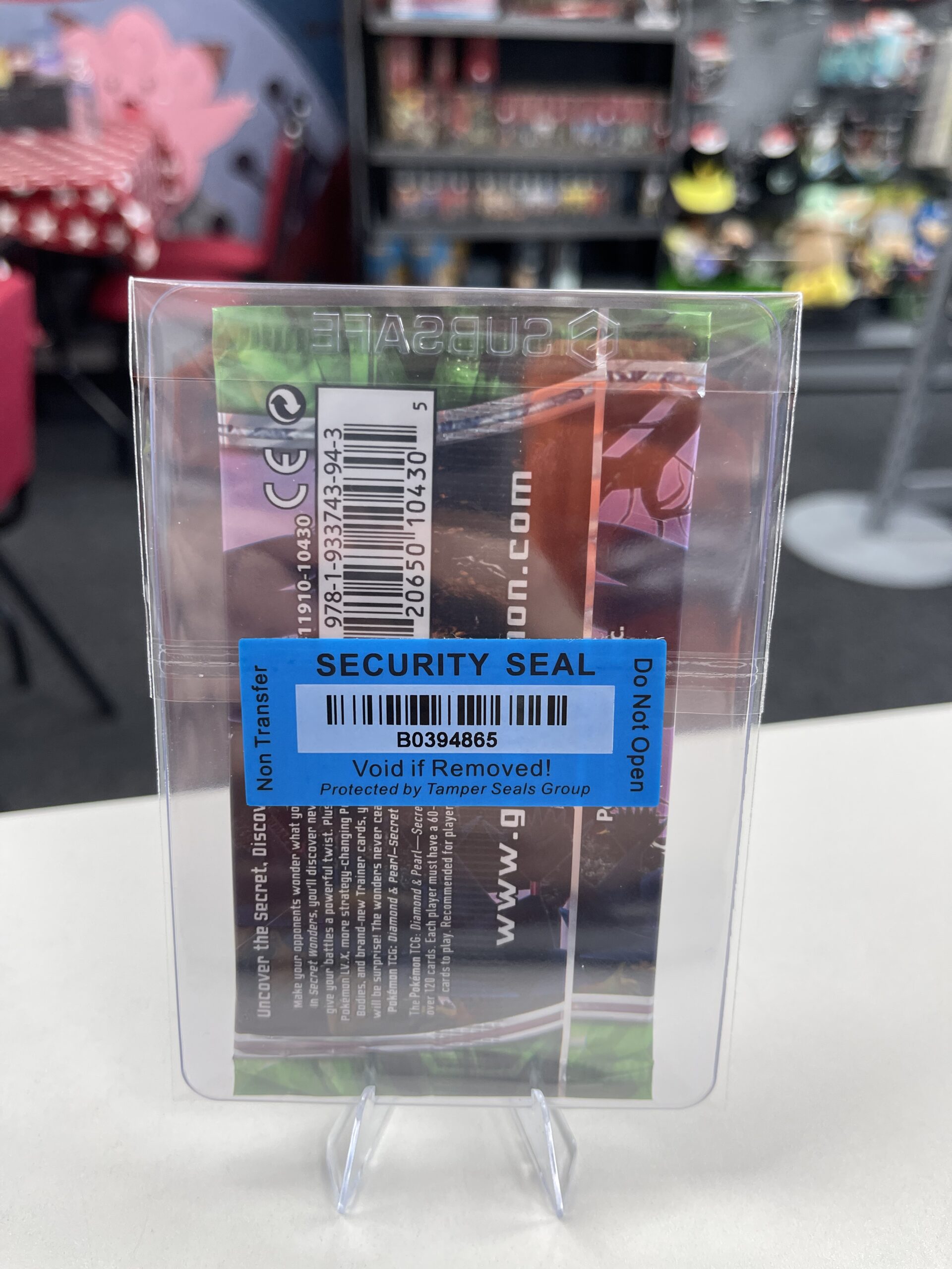 The WLC security seal on the back of the Honchkrow Secret Wonders booster pack, confirming its authenticity.