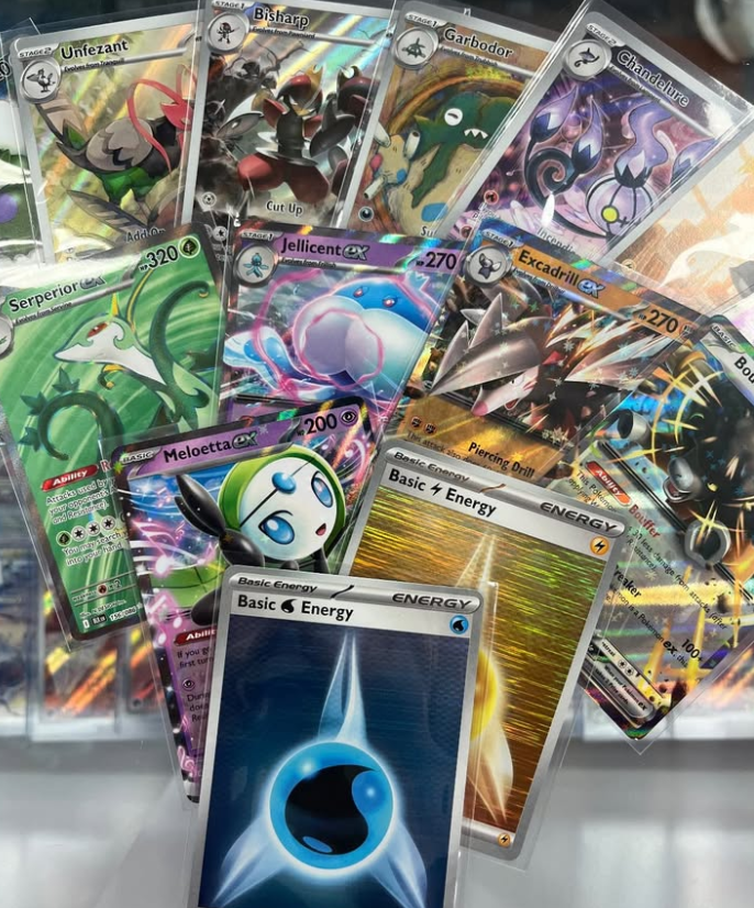 A fanned-out display showcasing the variety of Pokémon ex and full art cards available in the new Black & White Flare TCG expansion.