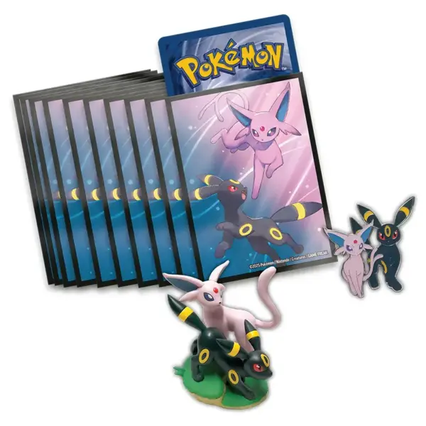 The accessories from the Pokémon Prismatic Evolutions Premium Figure Collection, including the Espeon & Umbreon figure, enamel pin, and card sleeves.