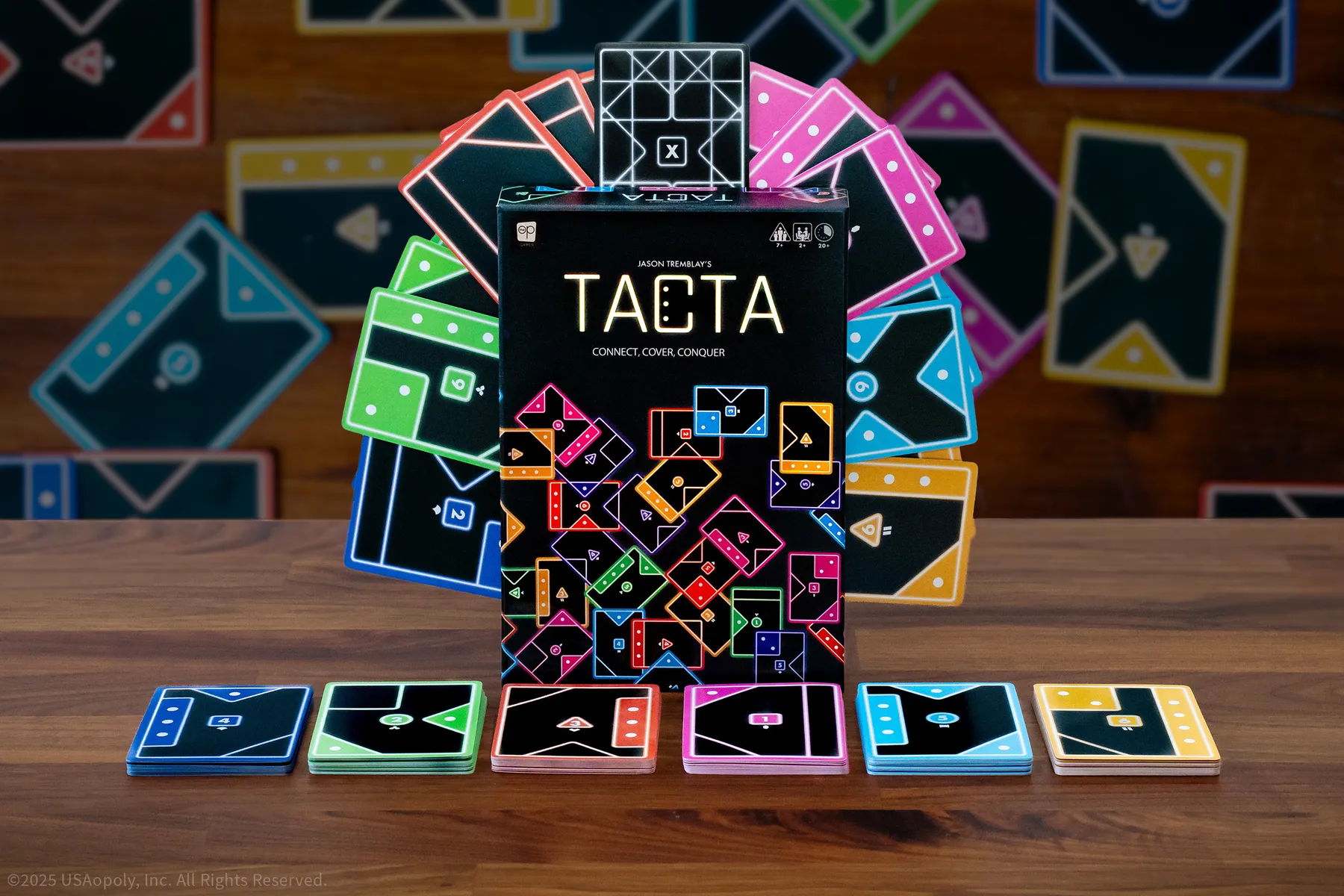 The Op Games Tacta strategic card game box with vibrant neon cards featuring geometric shapes in multiple colours