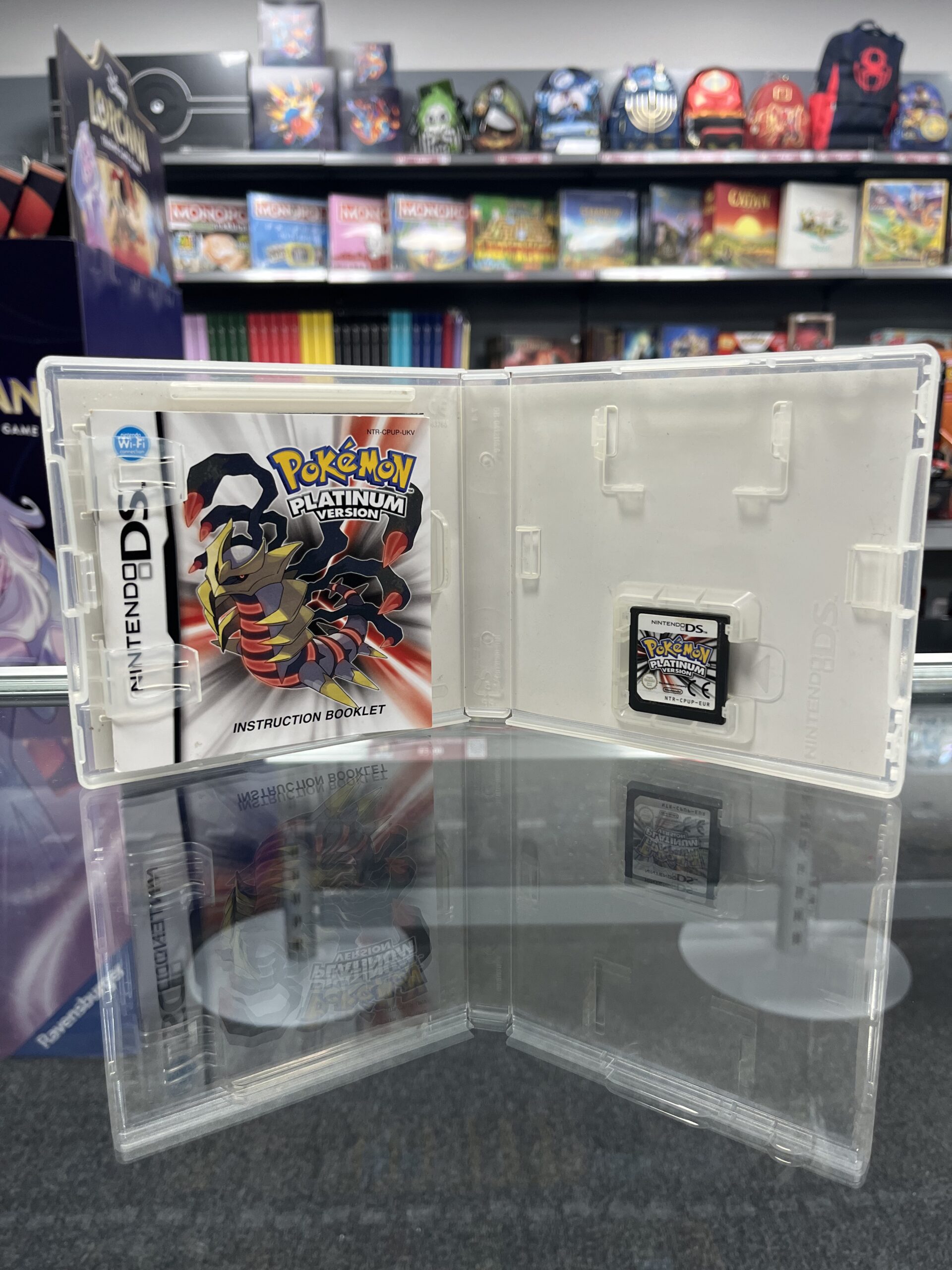 Inside view of Pokémon Platinum box showing game cartridge manual and inserts